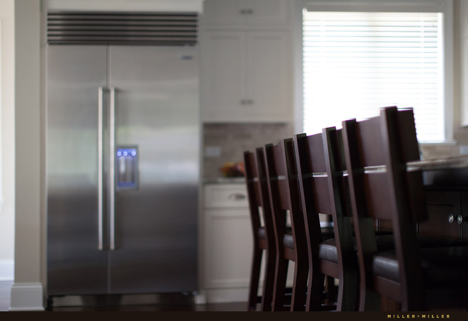 dark mahogany kitchen island contrasting white cabinets