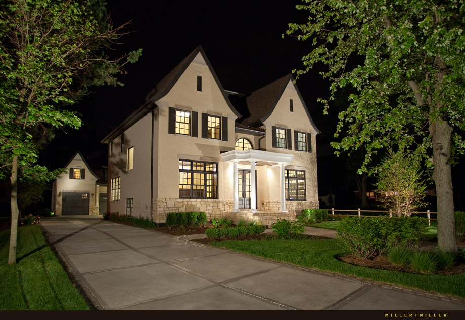 french stucco home detached carriage house garage